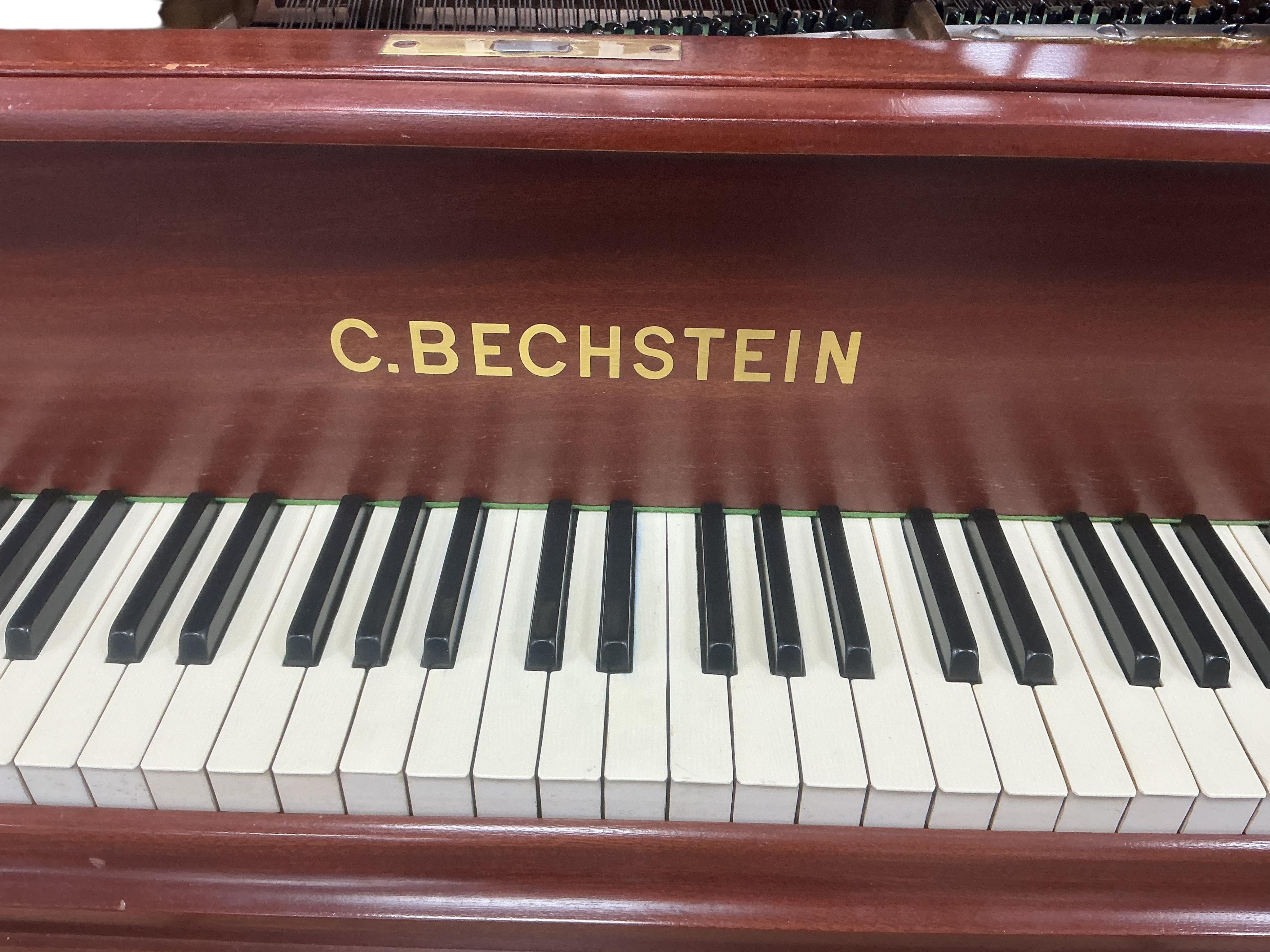 A Bechstein mahogany cased boudoir grand piano, model A, number 96003 (c.1910). Recently restrung, new felt to hammers and case re-polished, together with an adjustable ebonised piano stool. Length 182cm, depth 144cm.